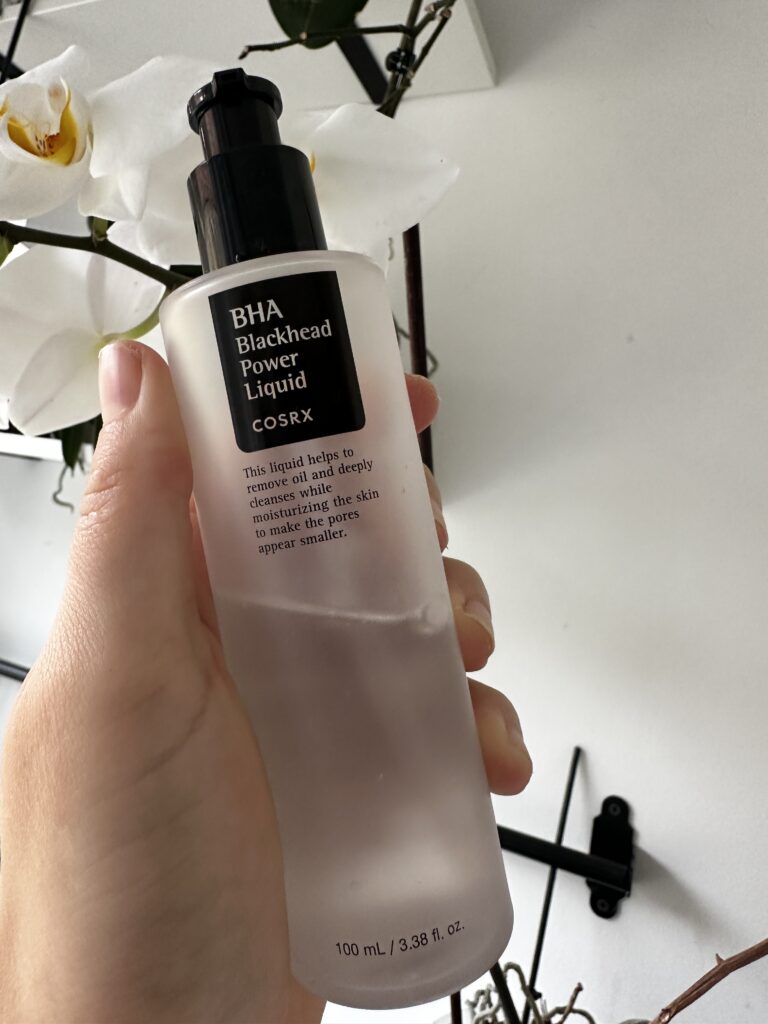 Flower background women hand salicylic acid serum