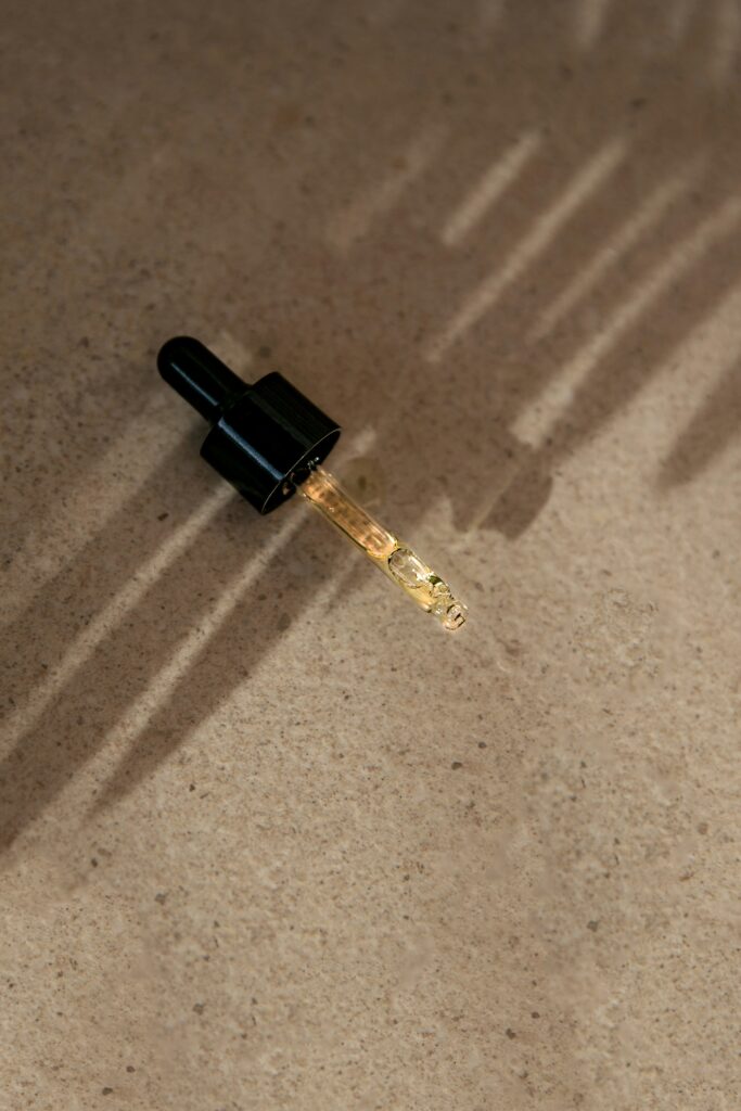 Beige background mandelic acid pipette