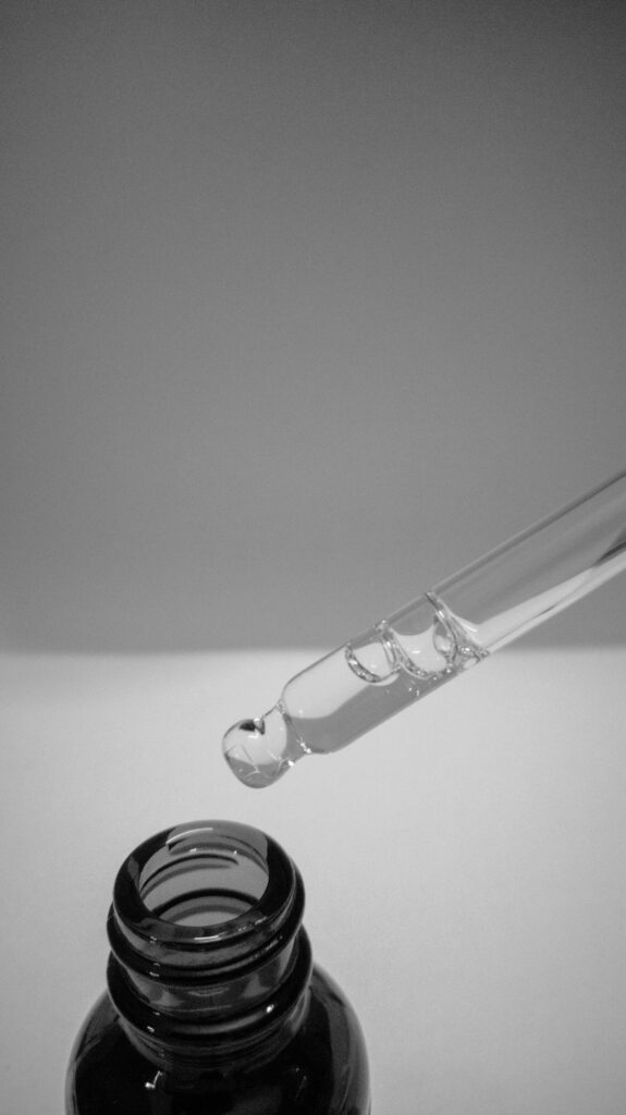 White grey background black pipette