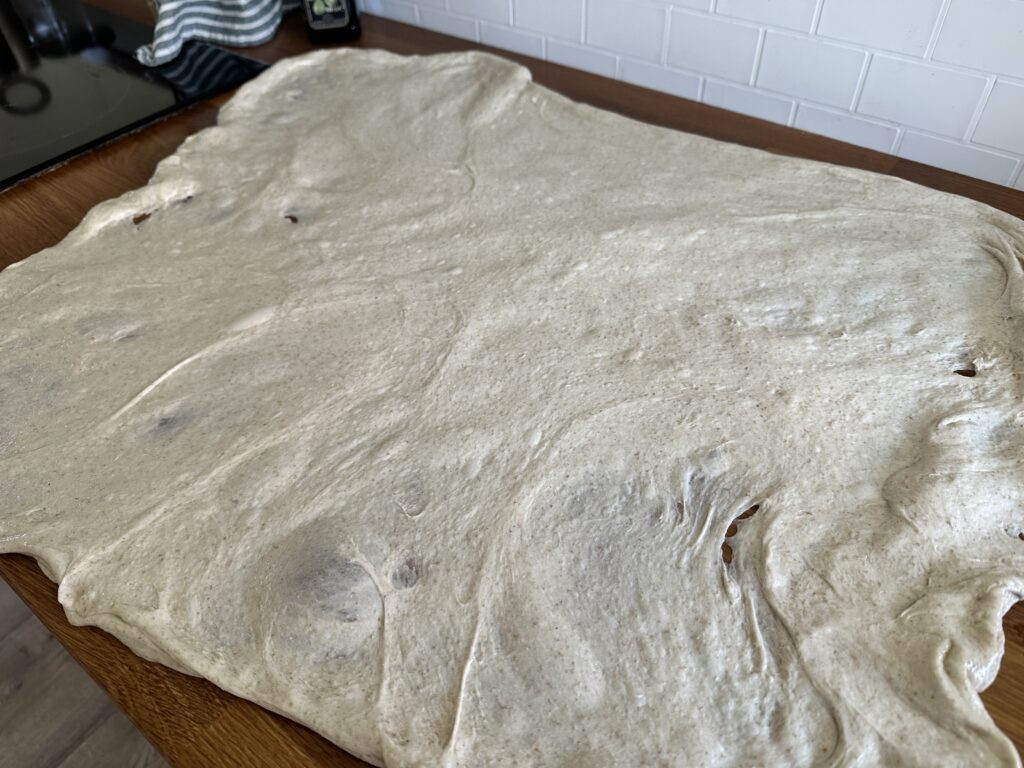Sourdough dough stretched thin during the lamination process.