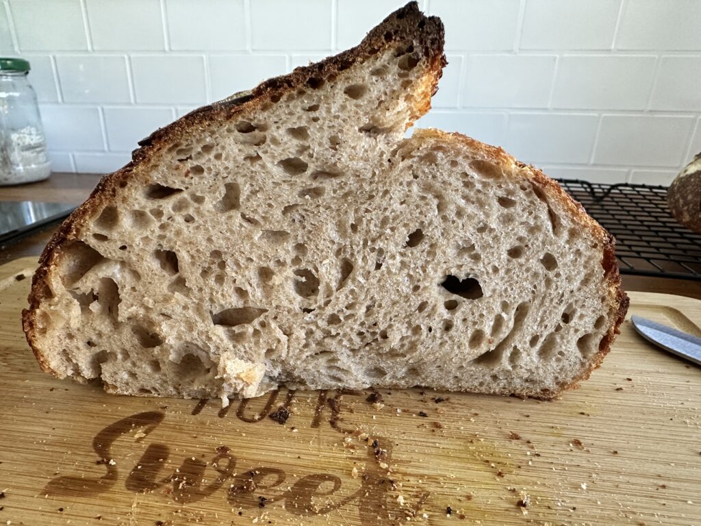 Homemade sourdough bread with open crumb and crispy crust.