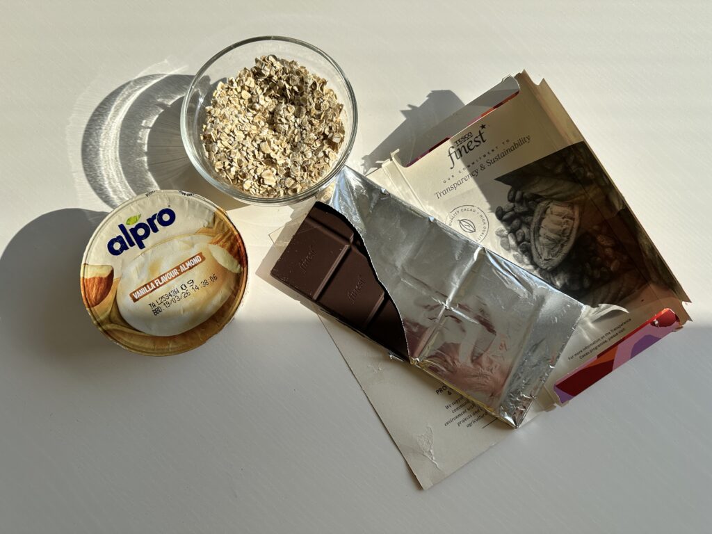 Ingredients for vanilla overnight oats arranged on a kitchen counter.