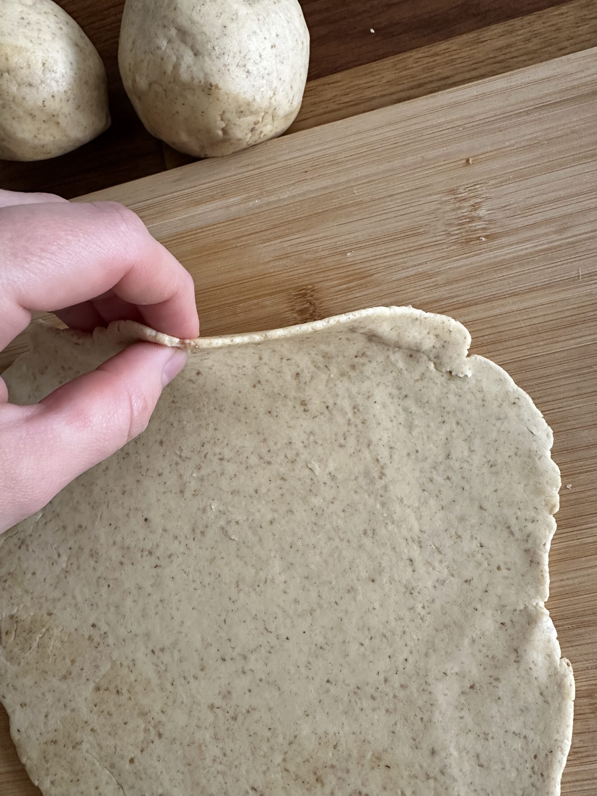 Thin rolled sourdough tortilla dough ready for cooking